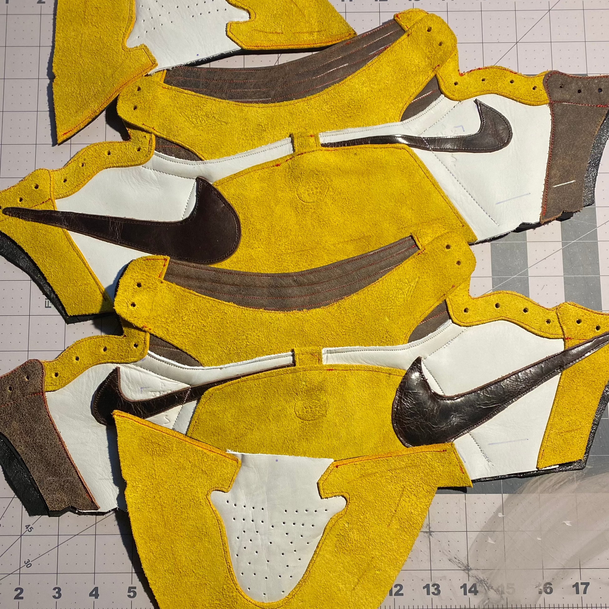 Yellow and white shoe design with Nike logo on a grid background